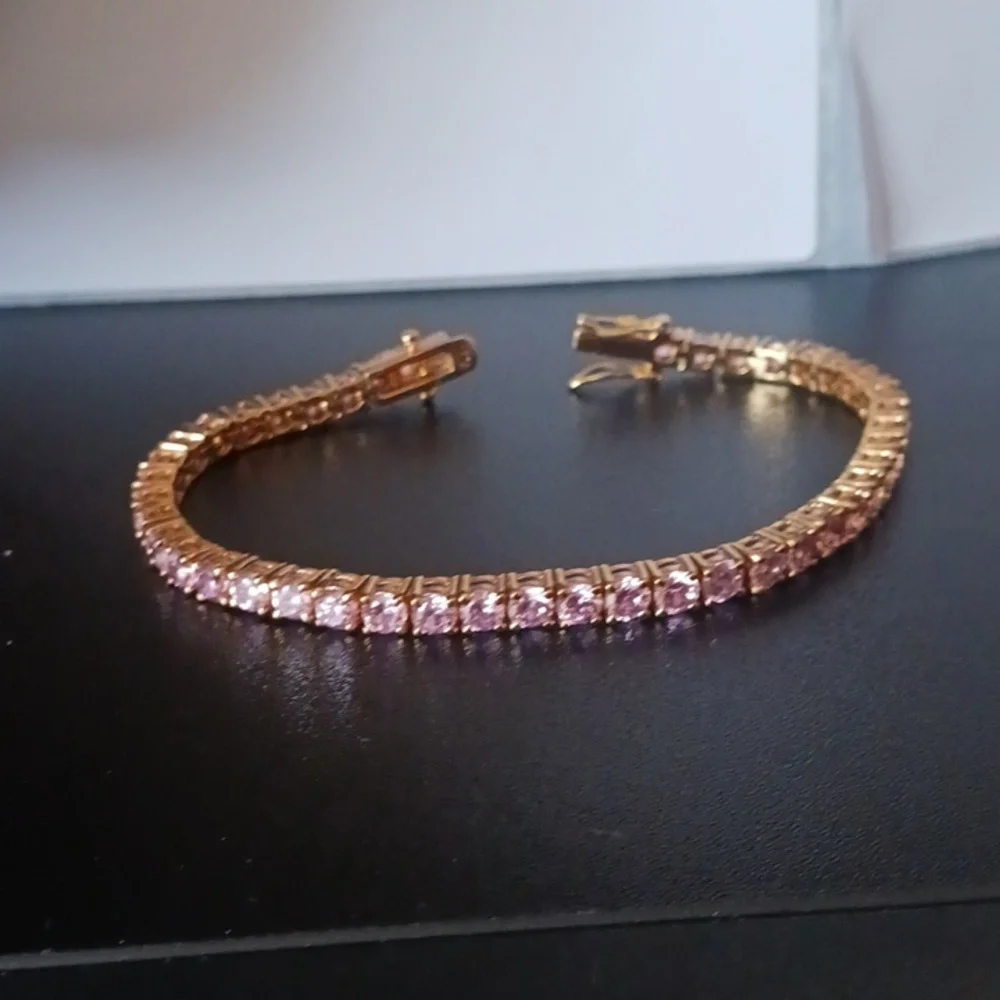 Elegant Gold Tone Bracelet with Pink Stones